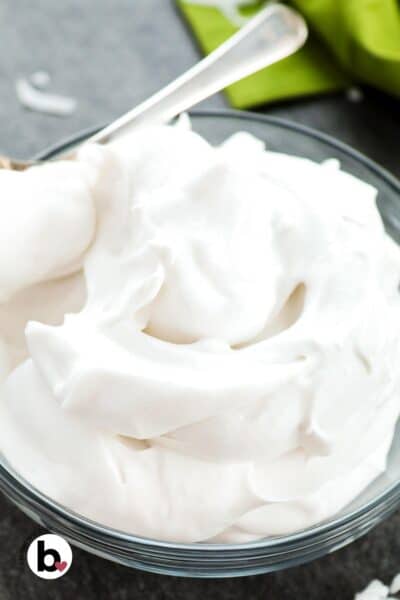 A bowl of fluffy whipped coconut cream.