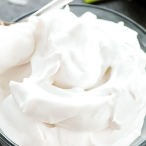 A bowl of fluffy whipped coconut cream.
