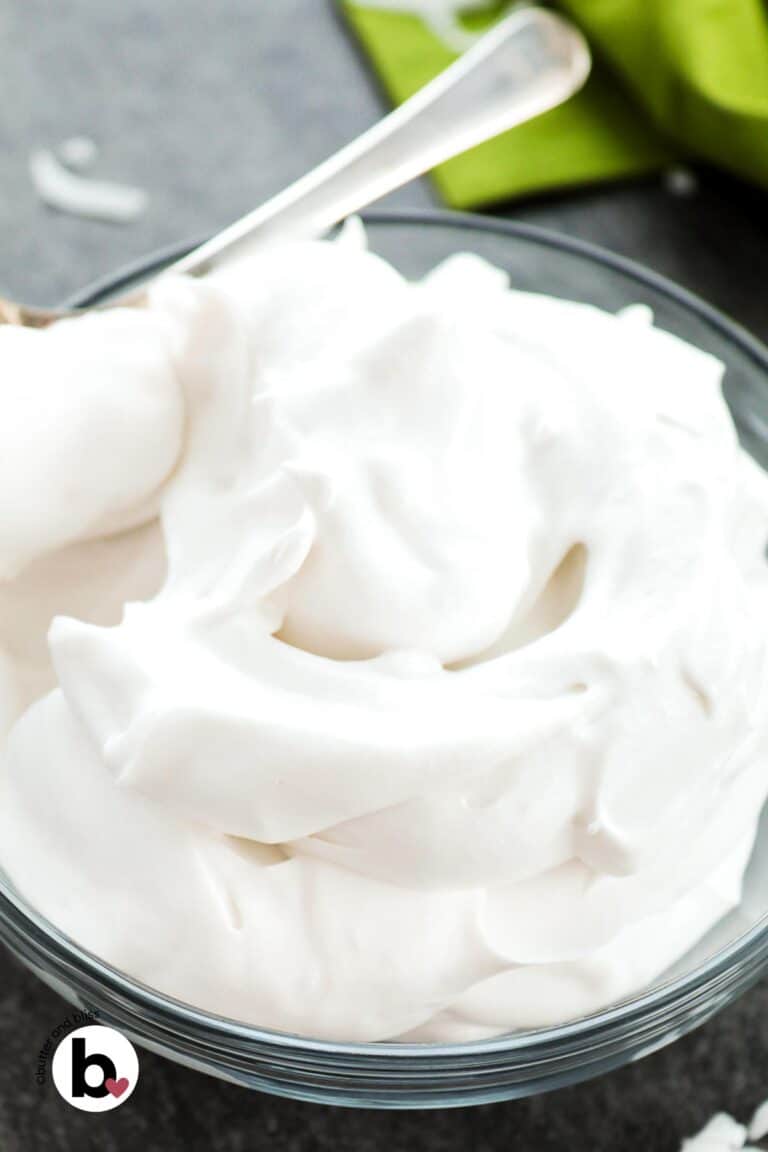 A bowl of fluffy whipped coconut cream.