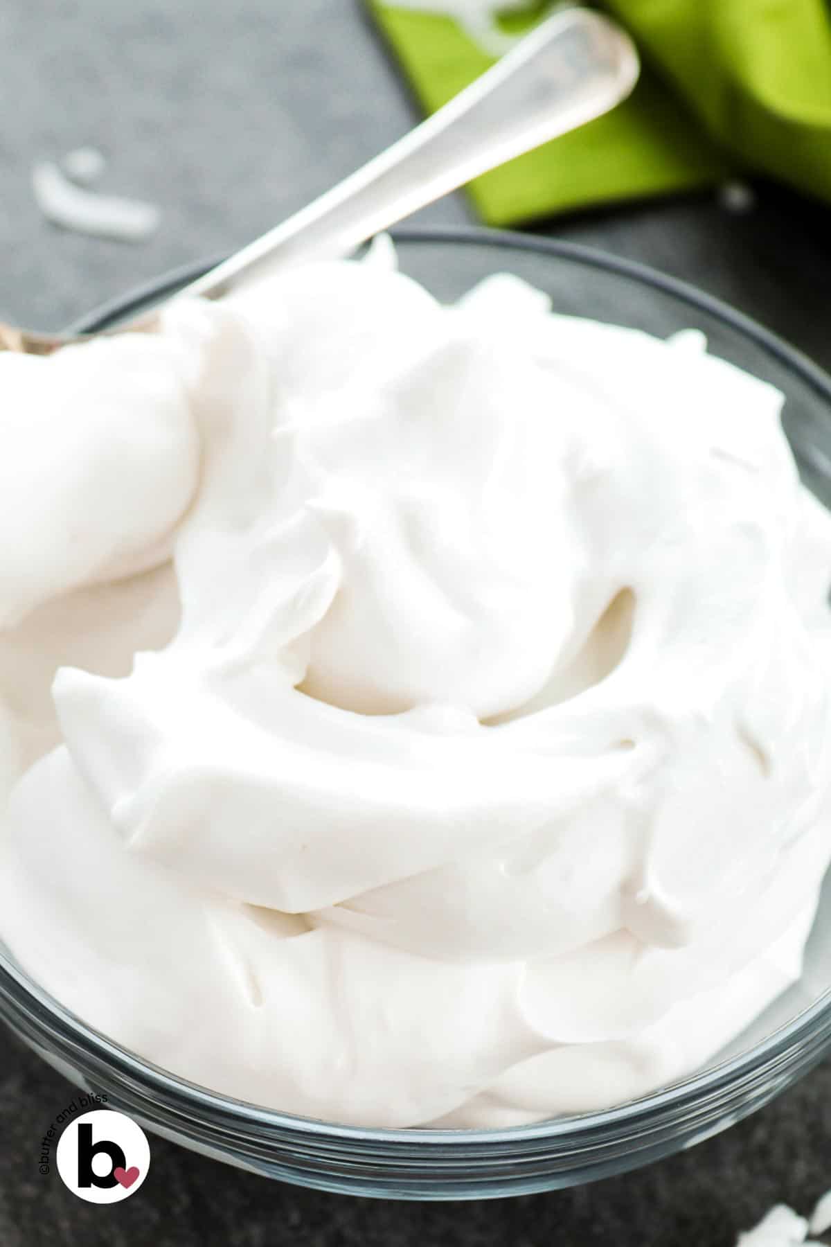 A bowl of fluffy whipped coconut cream.