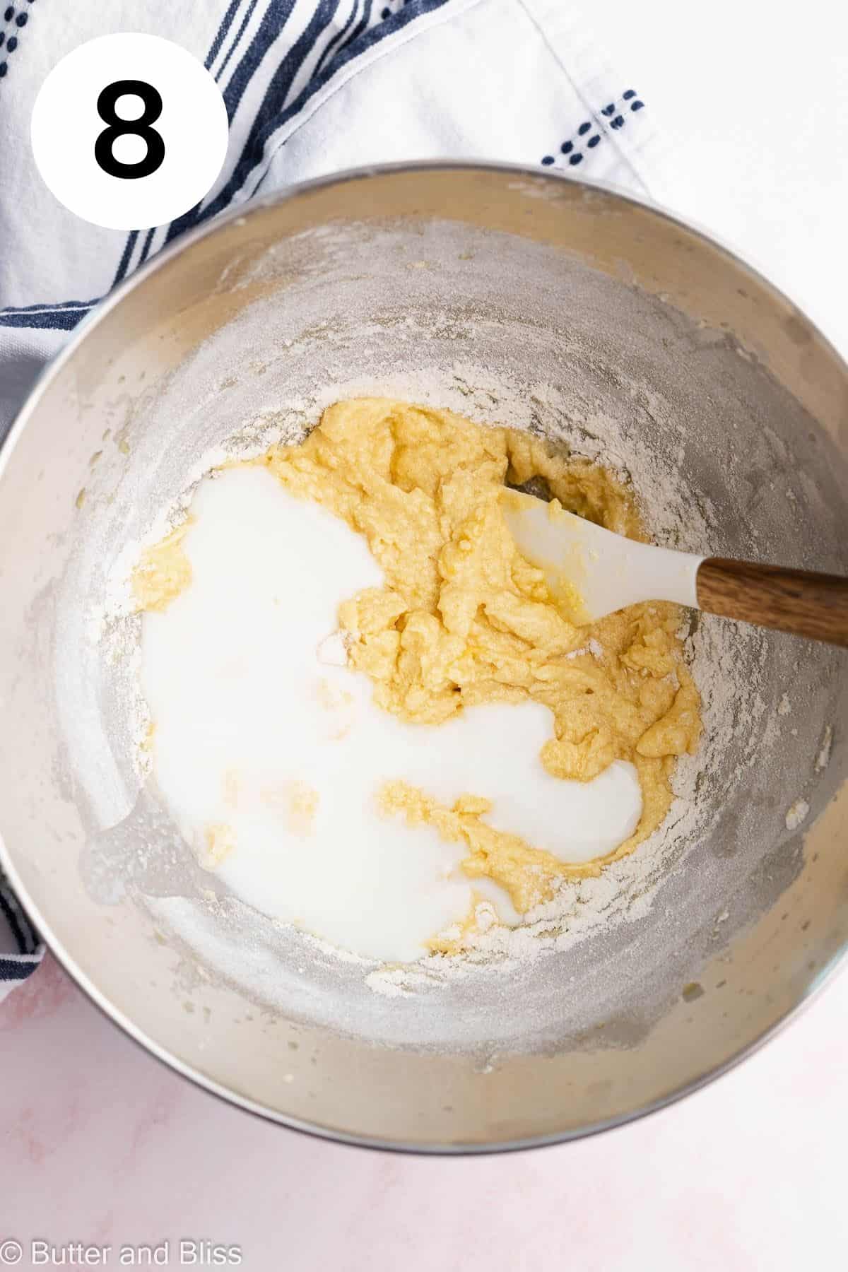 Buttermilk added to an upside down cake batter in a mixing bowl.