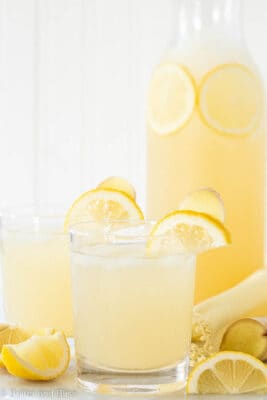 Ginger lemonade in glasses and a pitcher on a table