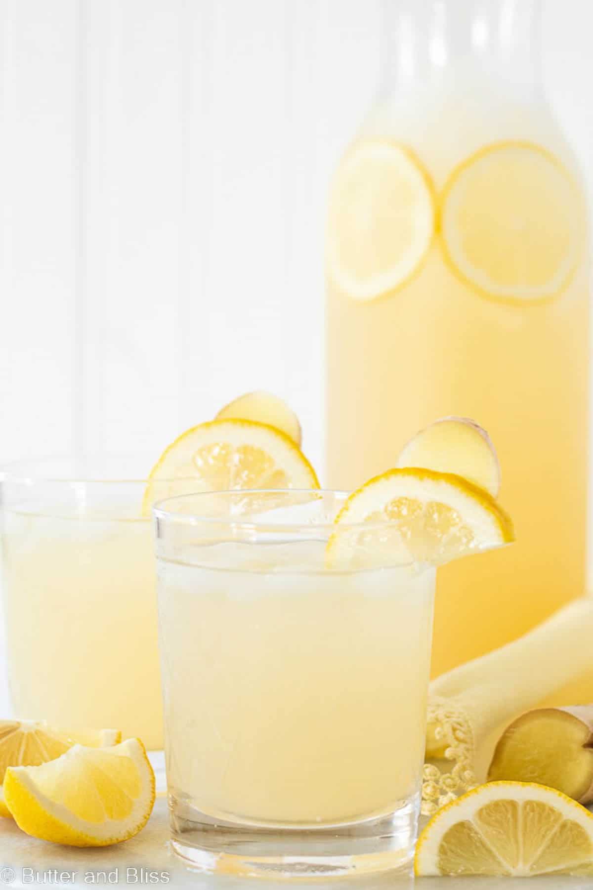 Ginger lemonade in glasses and a pitcher on a table