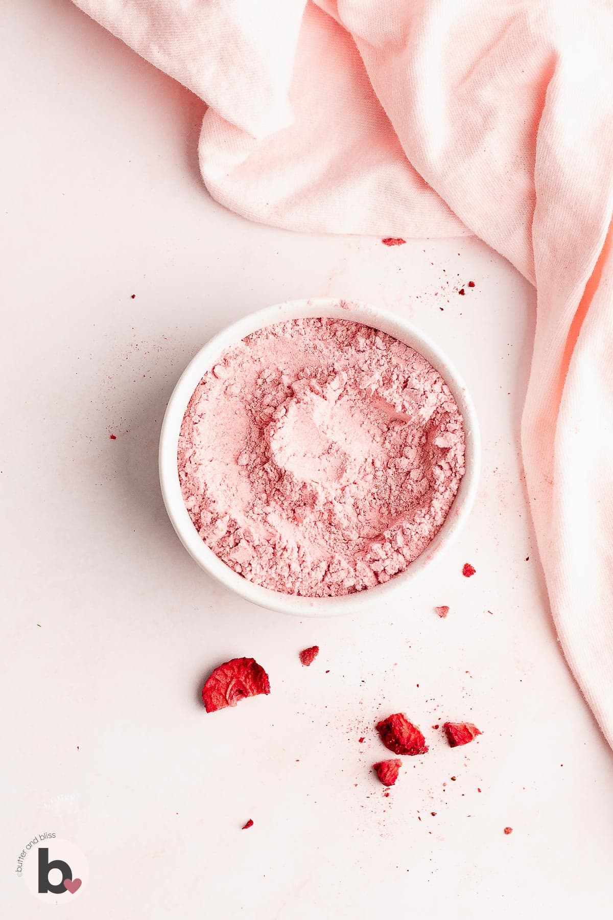 A bowl of finely ground freeze dried strawberries.