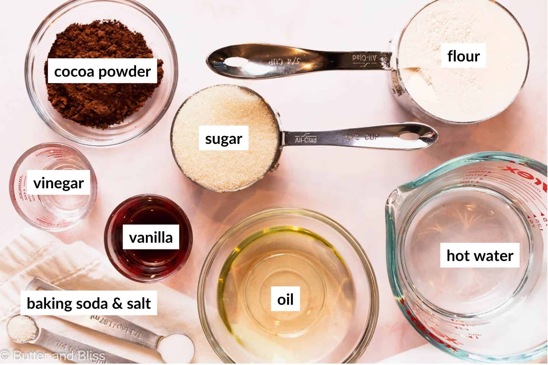 Ingredients for the easiest chocolate cake in measuring cups.