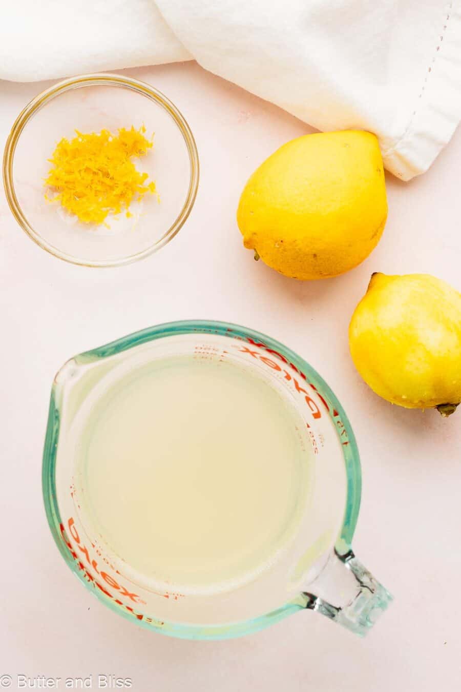 Lemon zest and juice in mixing bowls.