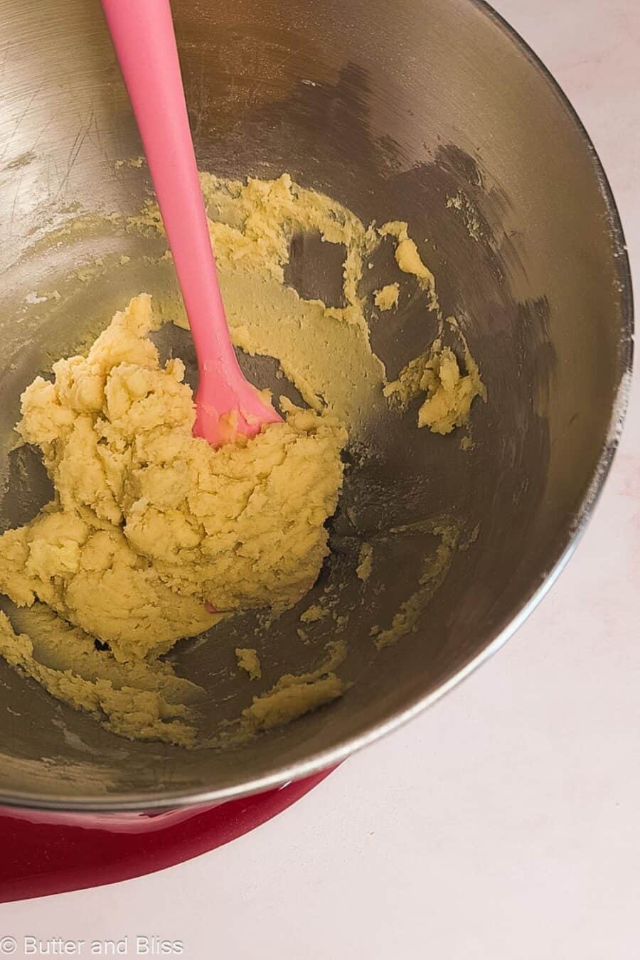 Shortbread cookie dough in a mixing bowl.