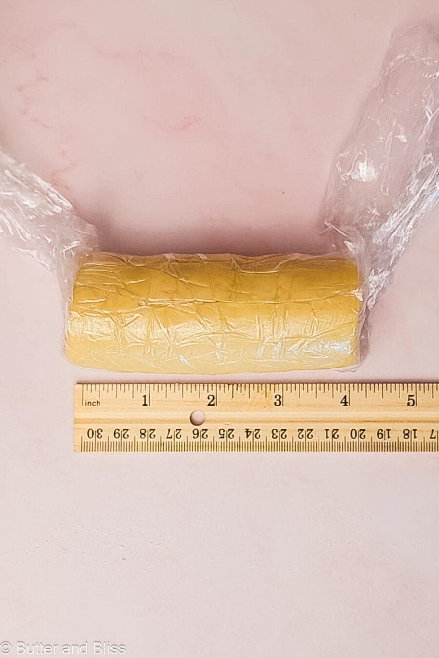 Lemon shortbread dough shaped into a log.