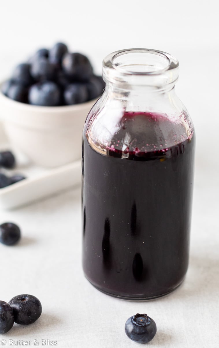 Small jar of blueberry simple syrup
