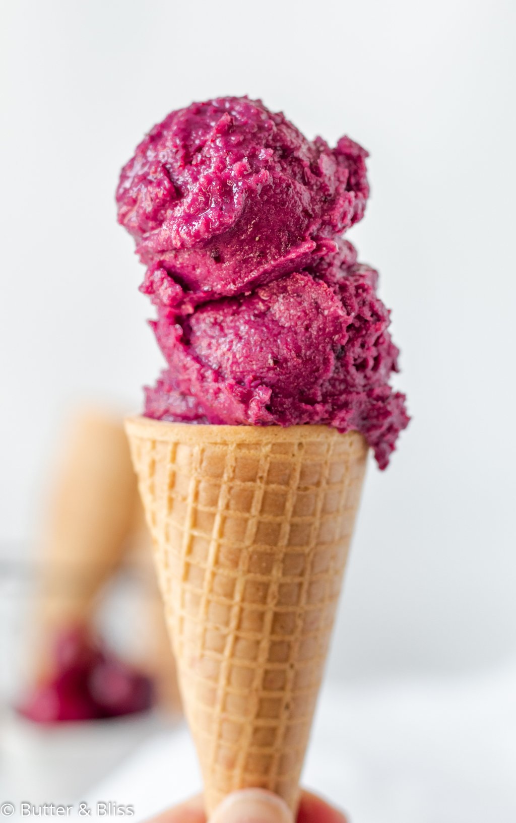 Cherry ice cream on a cone