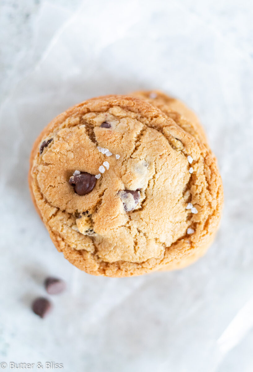A single chocolate chip cookie with caramel