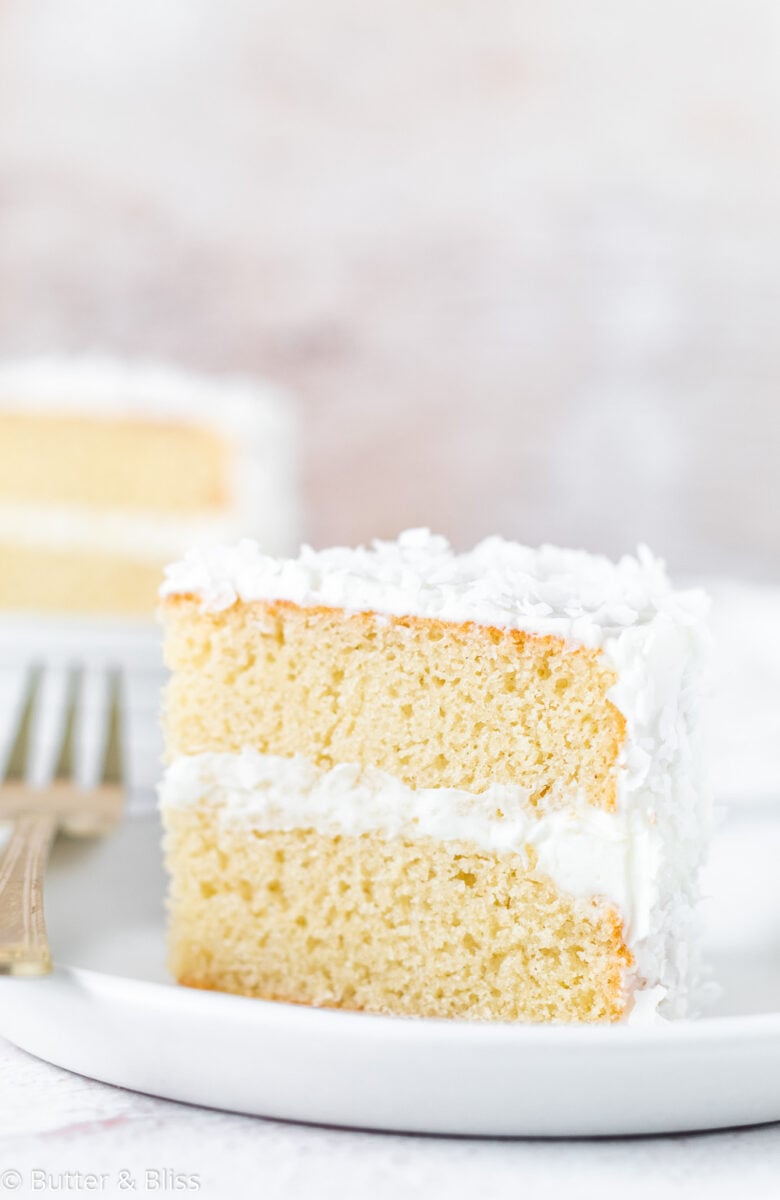 A small slice of coconut layer cake