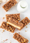 Slice of cinnamon caramel nut crumble bars