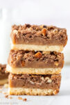 Stack of caramel nut crumble bars