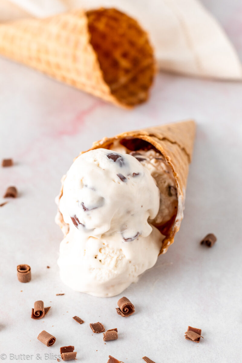 Vanilla malted milk candy ice cream in a cone