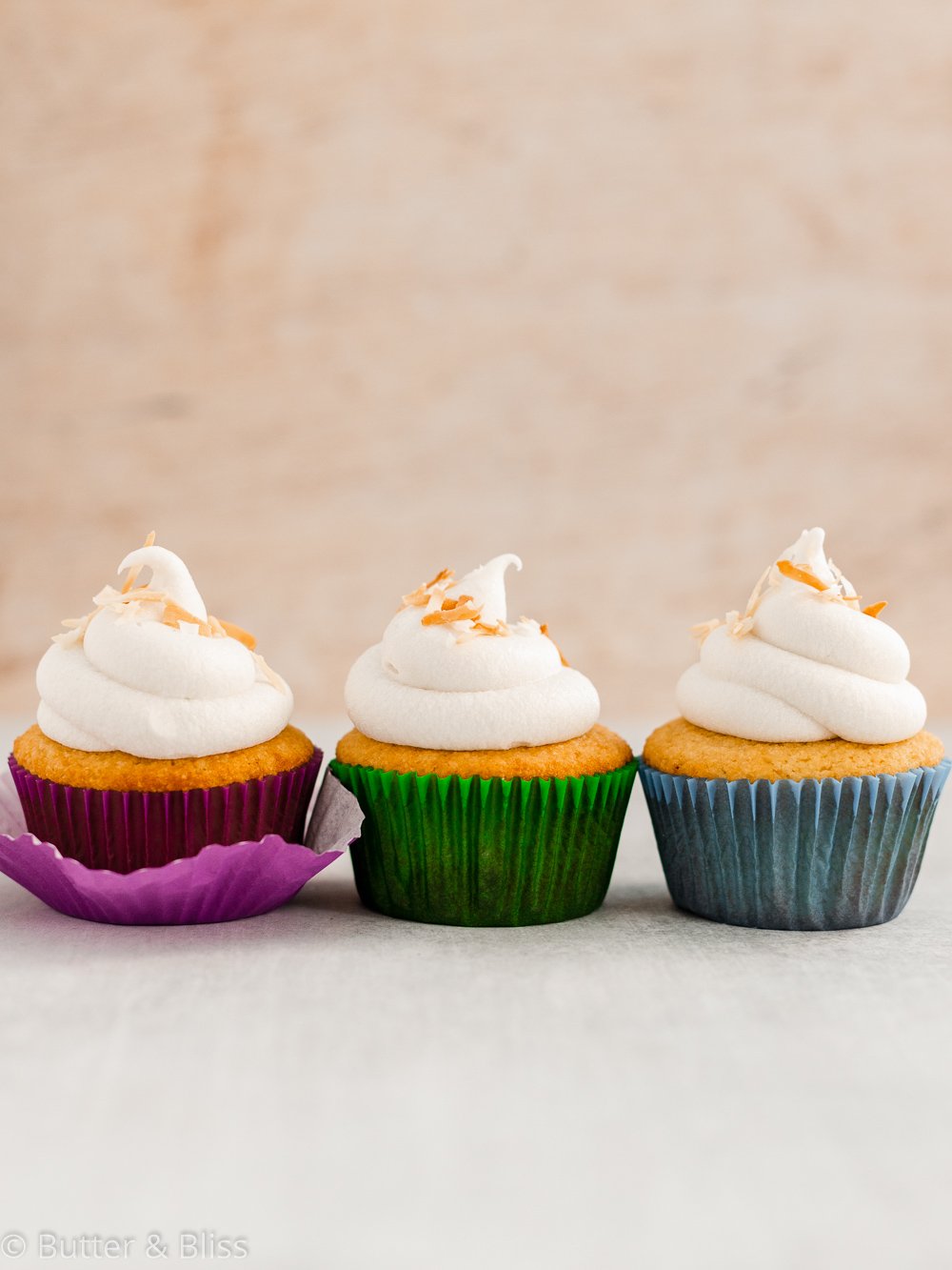 Gluten free vanilla cupcakes in a row