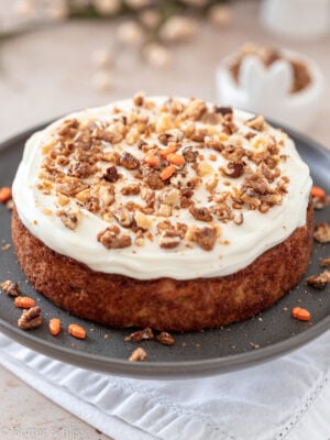Frosted carrot cake on a serving platter