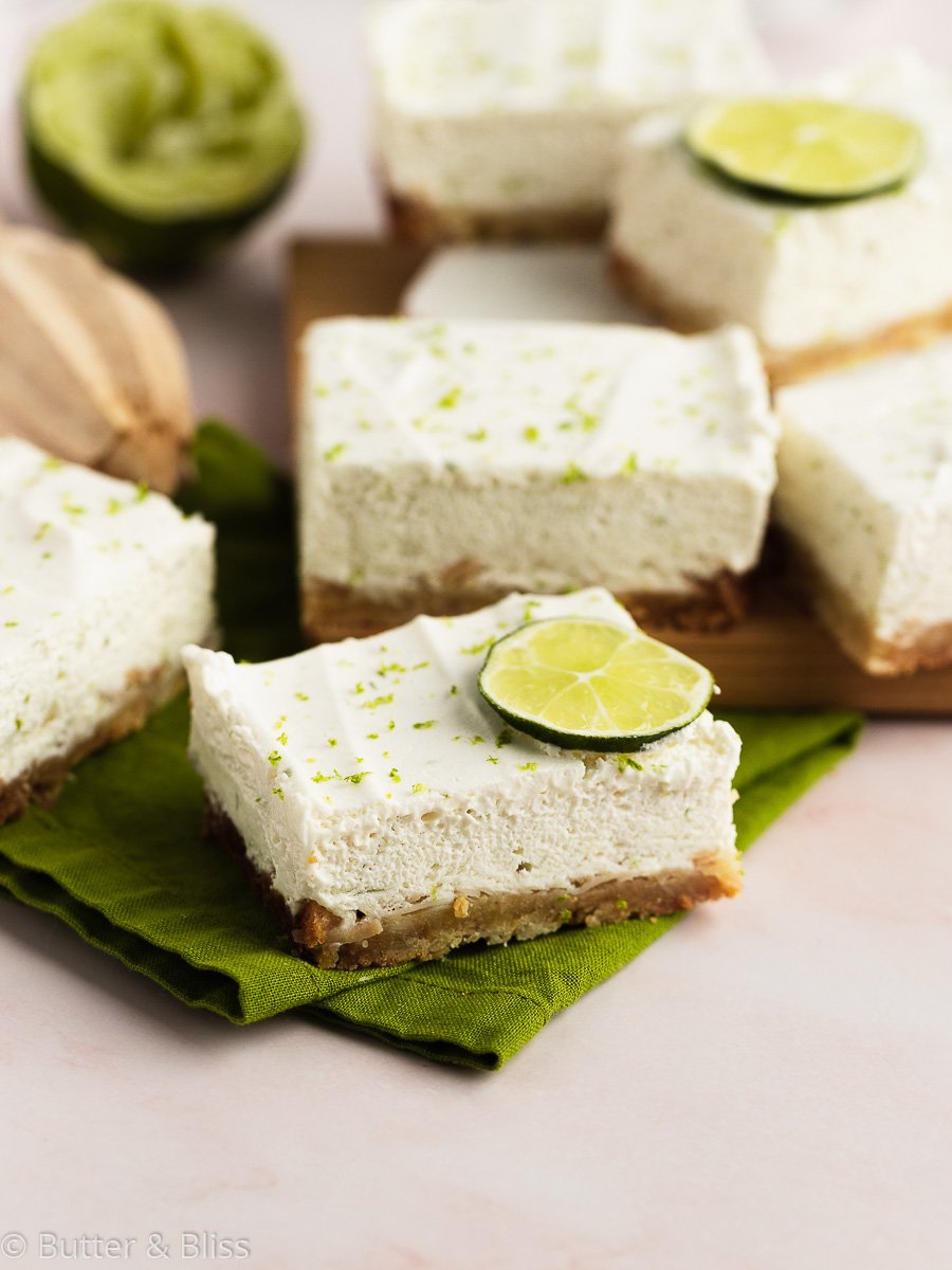 Slices of key lime bars on a napkin