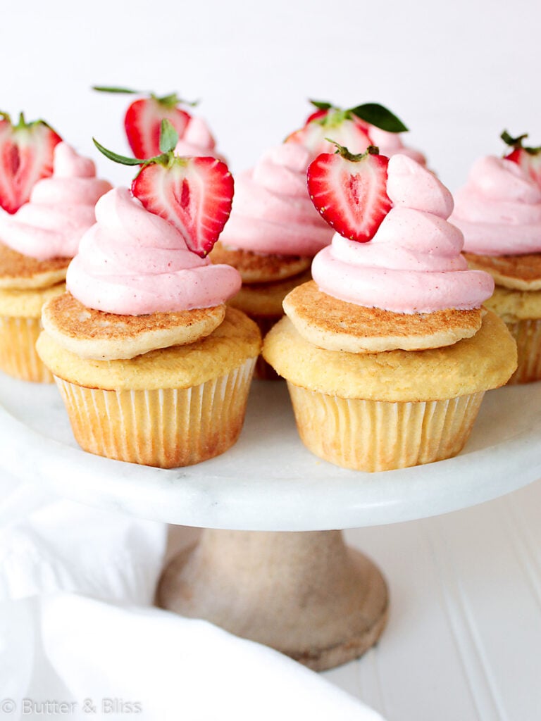 Maple and strawberry cupcakes on a platter