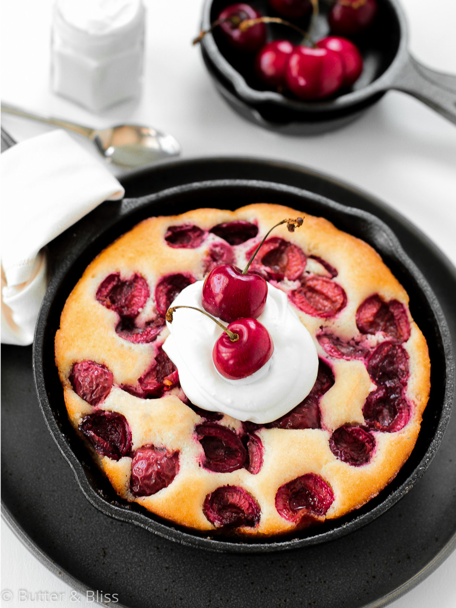 Mini cherry skillet cake with whipped cream