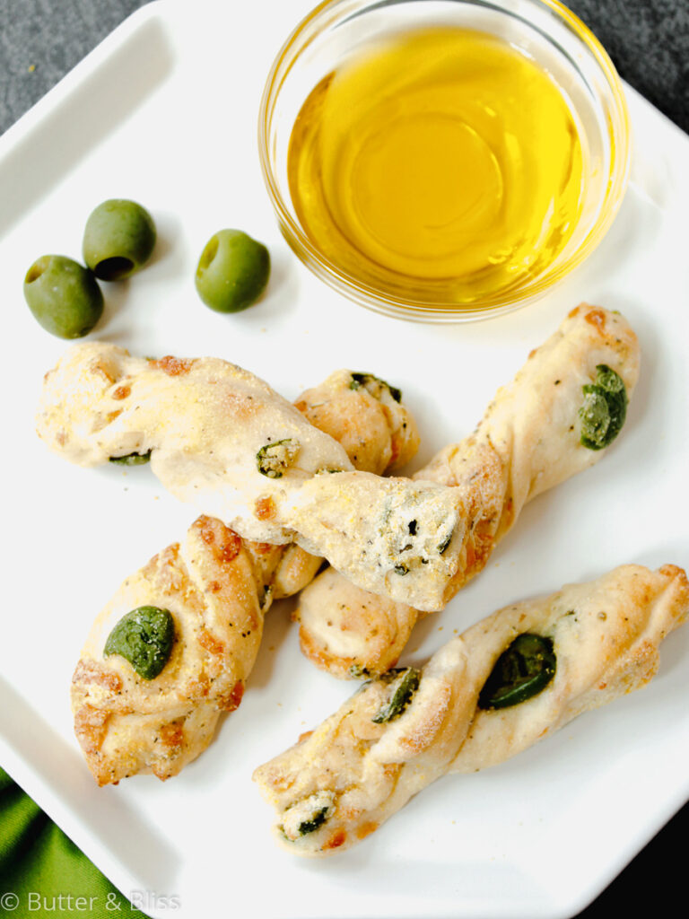 Olive breadsticks on a plate