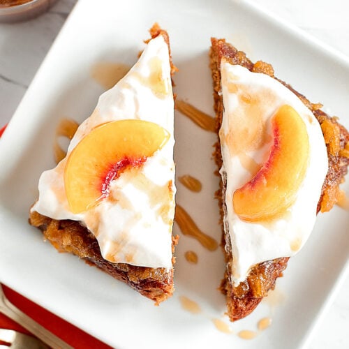 Two slices of peach caramel cake on a plate