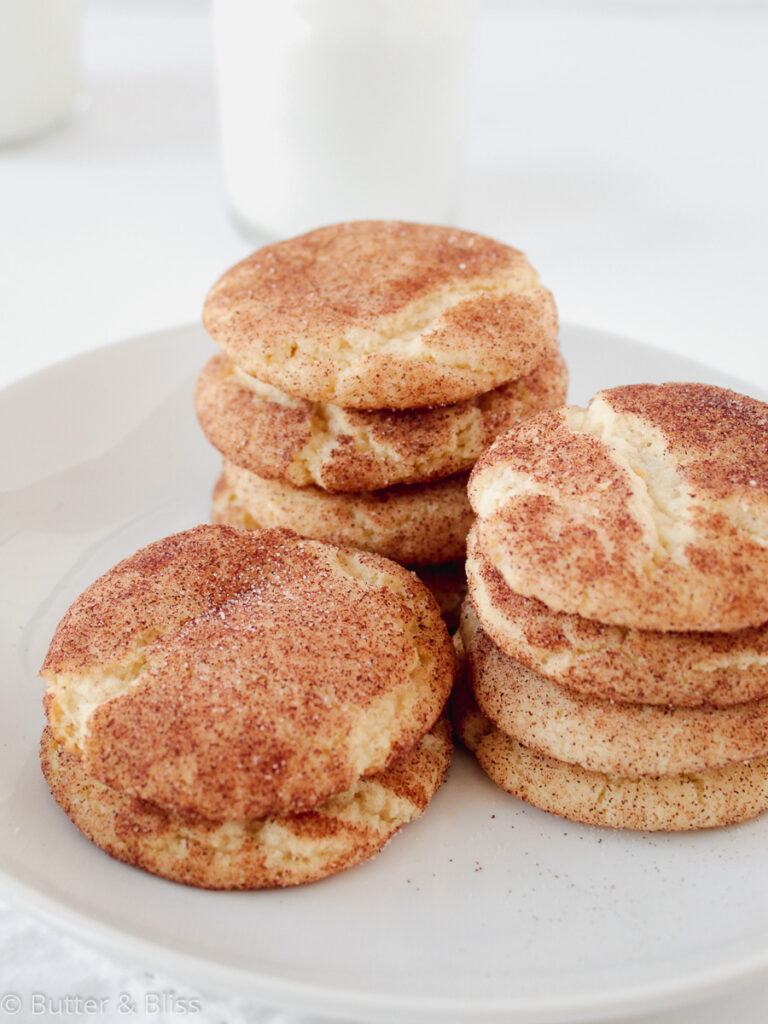 Cinnamon sugar cookies stacked on a plate