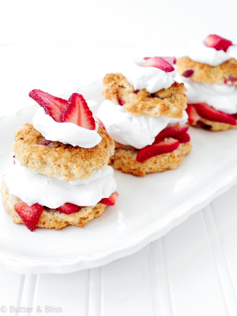 Row of strawberry shortcakes on a plate