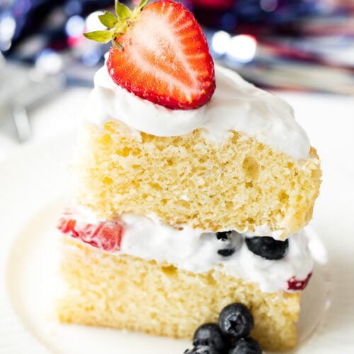 Slice of layered vanilla and berry cake