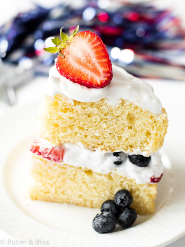 Slice of layered vanilla and berry cake