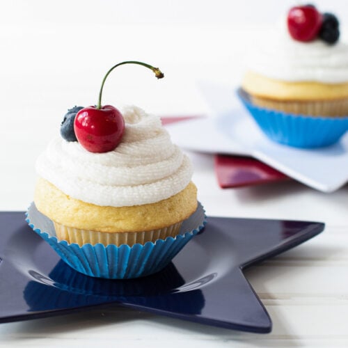 Vanilla cupcakes with berries on top