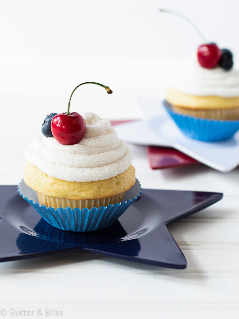 Vanilla cupcakes with berries on top