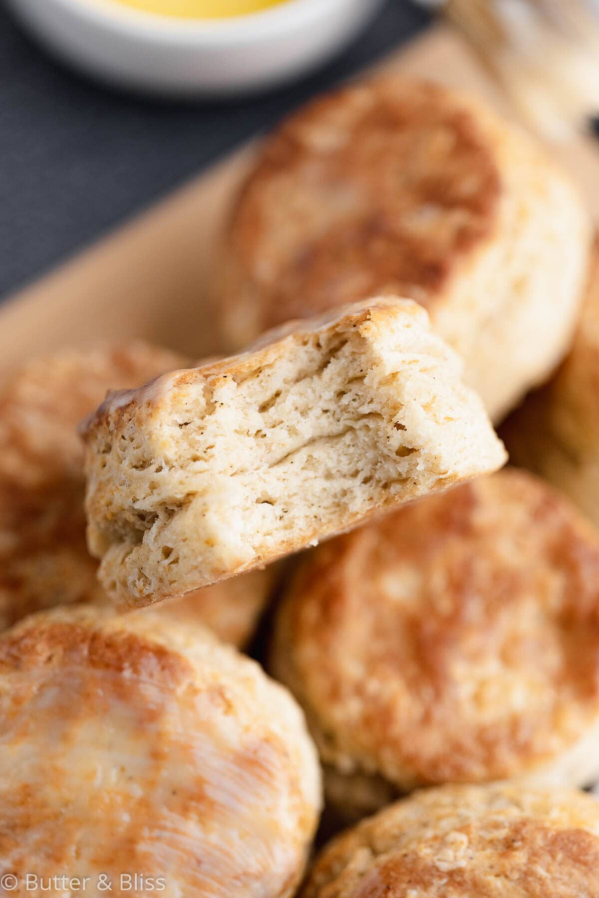 Bite of a homemade buttermilk biscuit