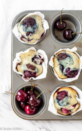 Fresh baked cherry and chocolate muffins in a pan