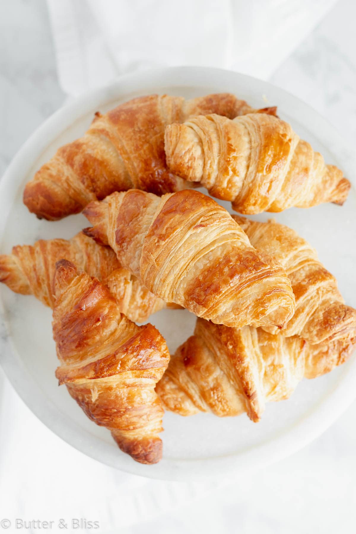 https://butterandbliss.net/wp-content/uploads/2021/05/Homemade-Croissants-BUTTERANDBLISS-2-of-9.jpg