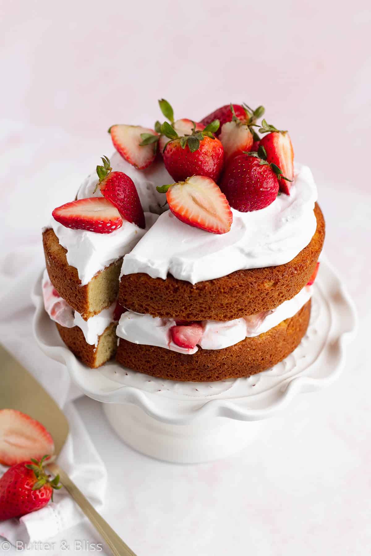 Mini strawberry cake with a slice cut