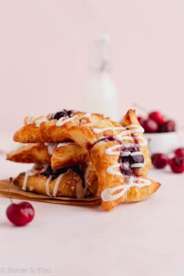 Pinwheel danish pastries stacked and glazed