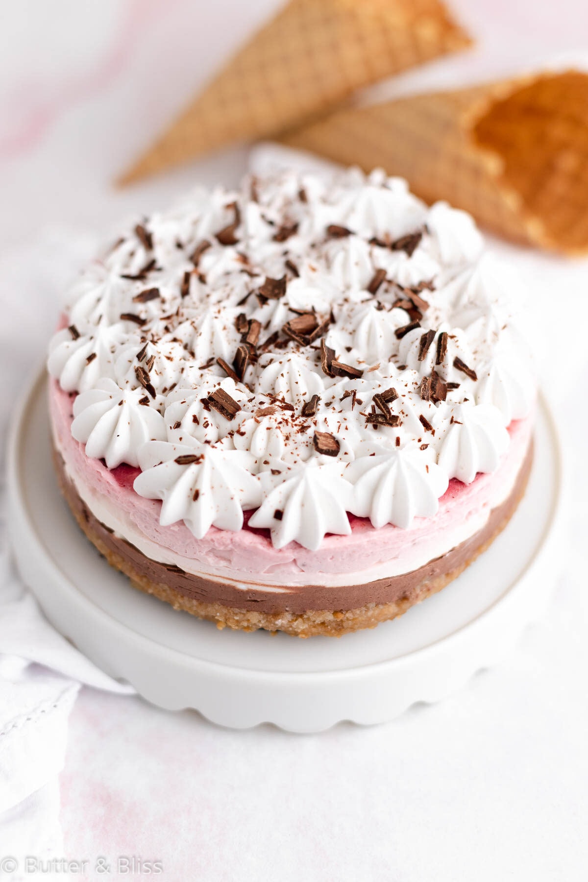 Mini neapolitan cheesecake with waffle cones for the crust
