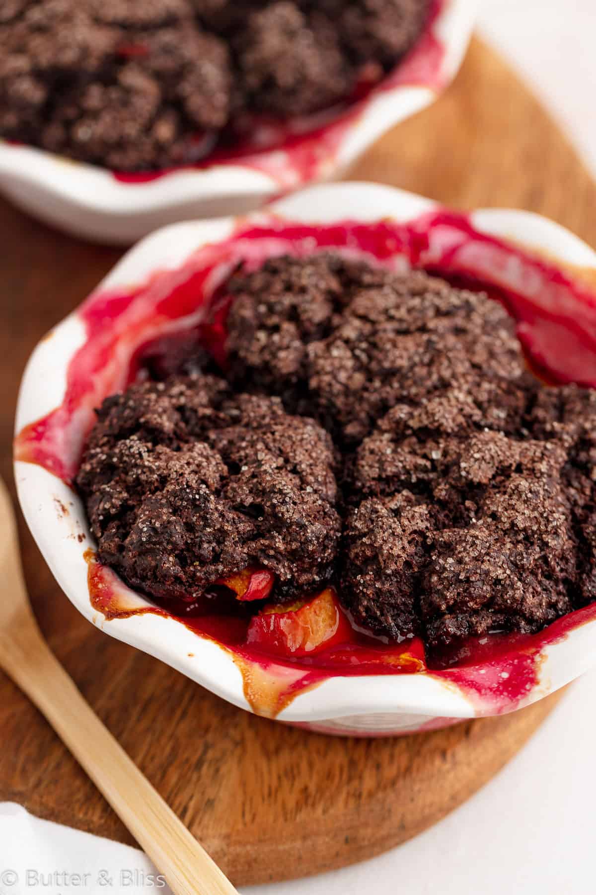 Close up of chocolate stone fruit cobbler in pie dish.