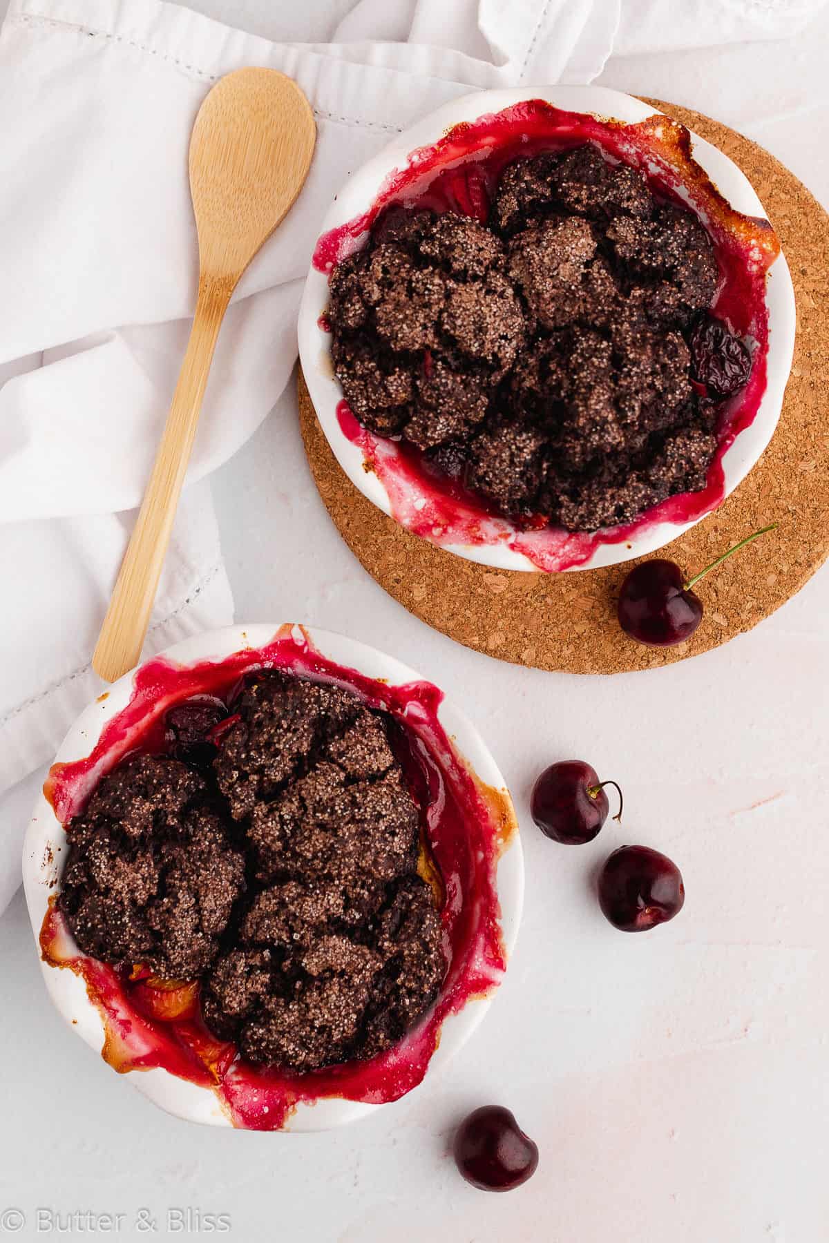 Two summer cobblers in small pie dishes