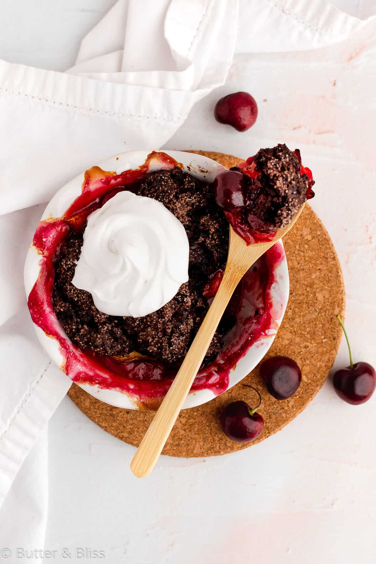 Summer fruit chocolate cobbler with whipped cream on top