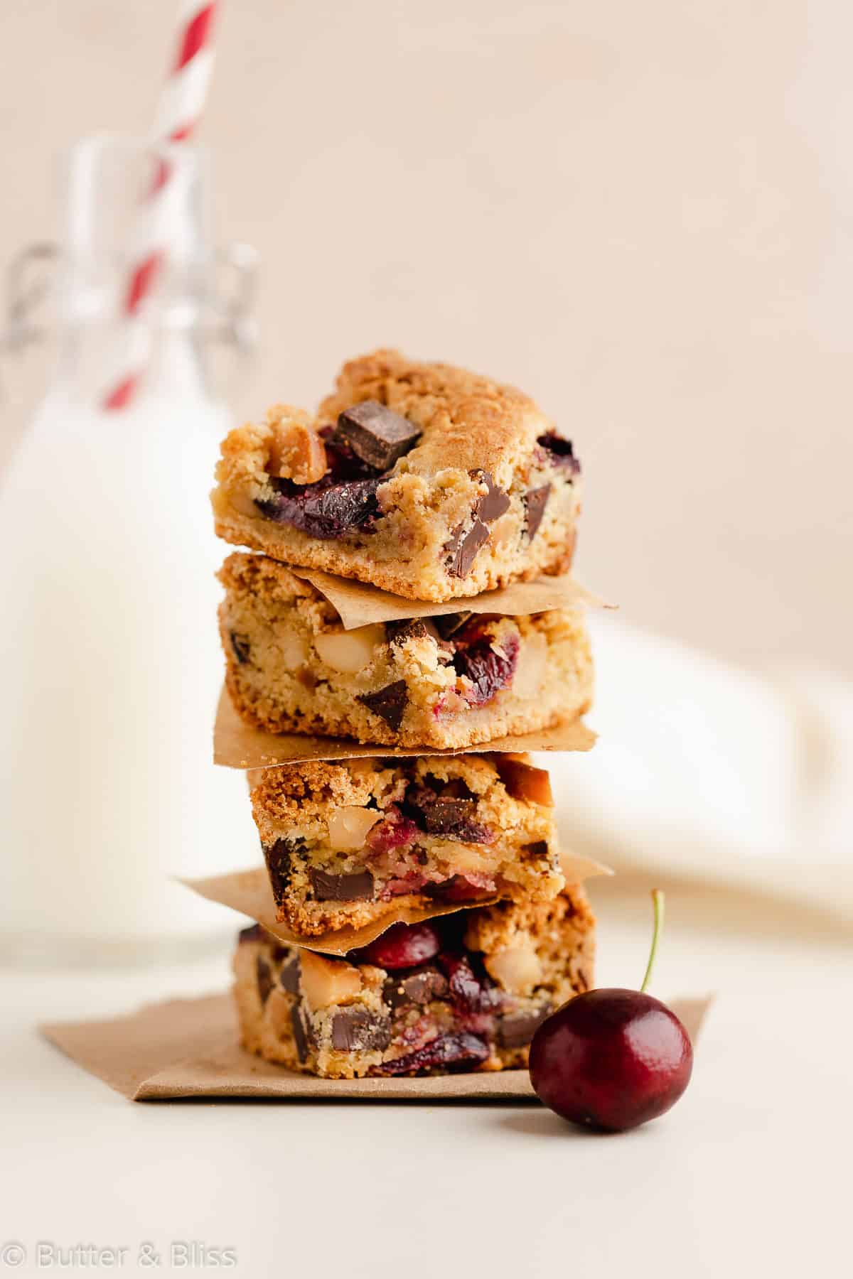 A stack of macadamia nut and cherry gluten free blondies