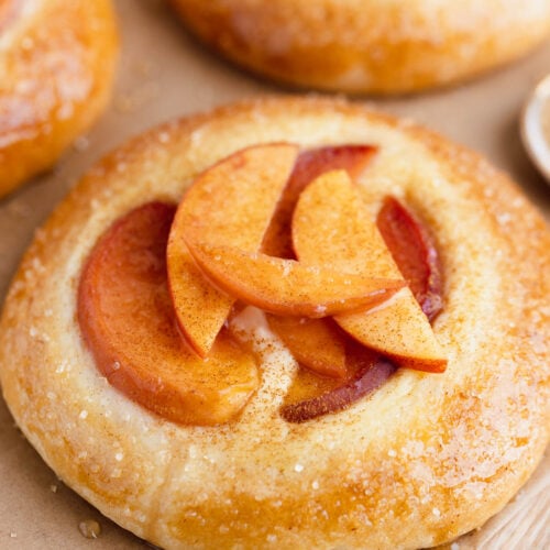 Close up of a peach and vanilla custard mini kuchen pie
