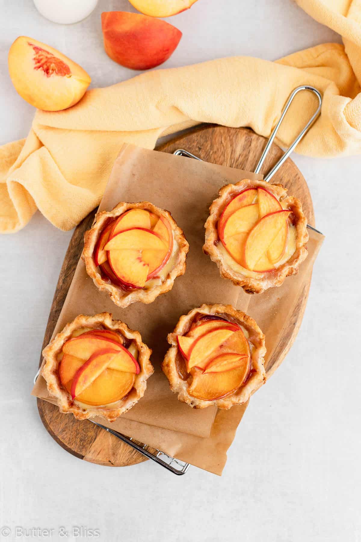 Small batch of mini peaches and cream pies on a table