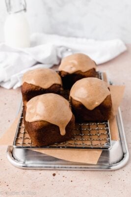 Banana bread mini loaves with caramel icing on a wire rack