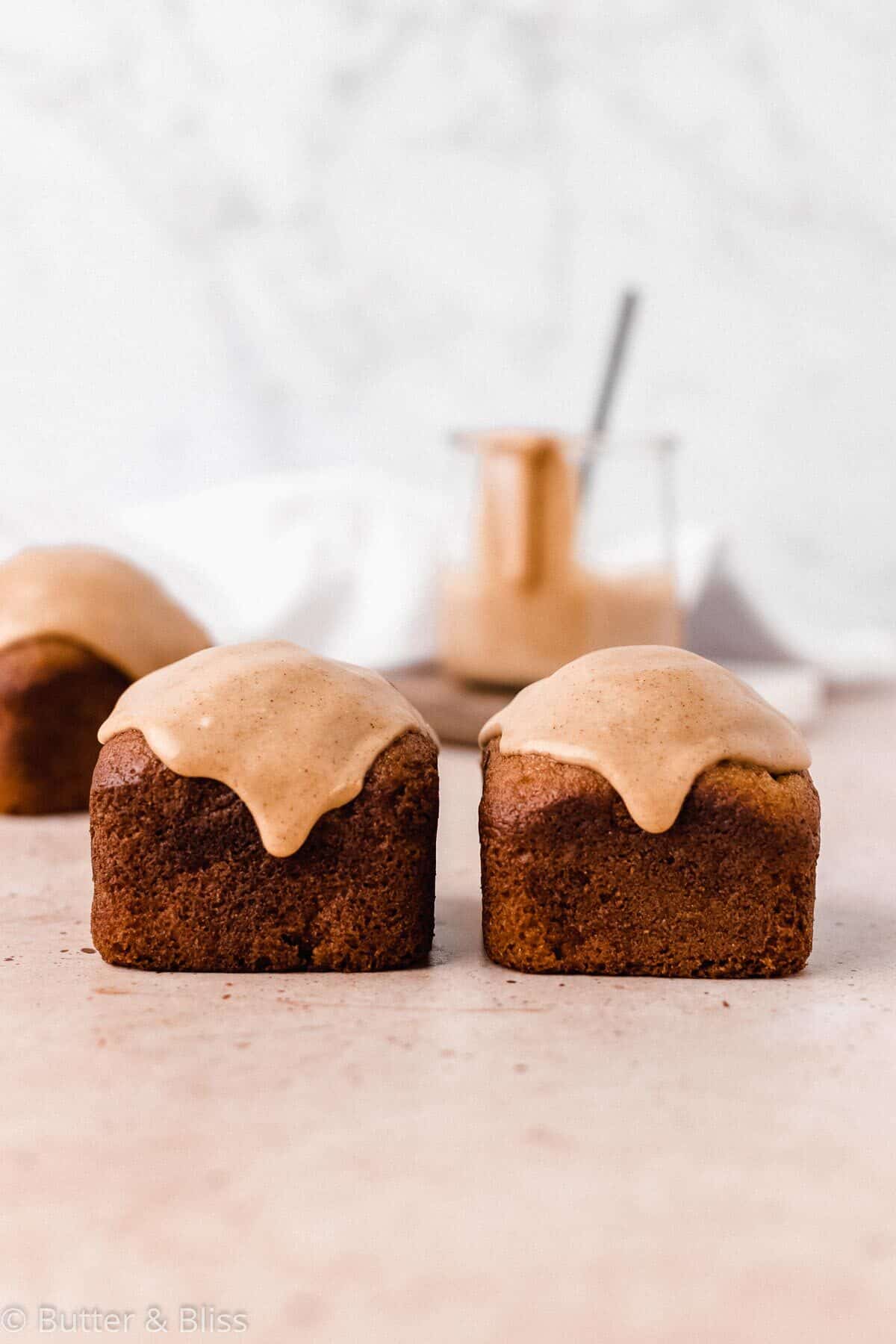 Two mini loaves of quick bread with caramelized icing