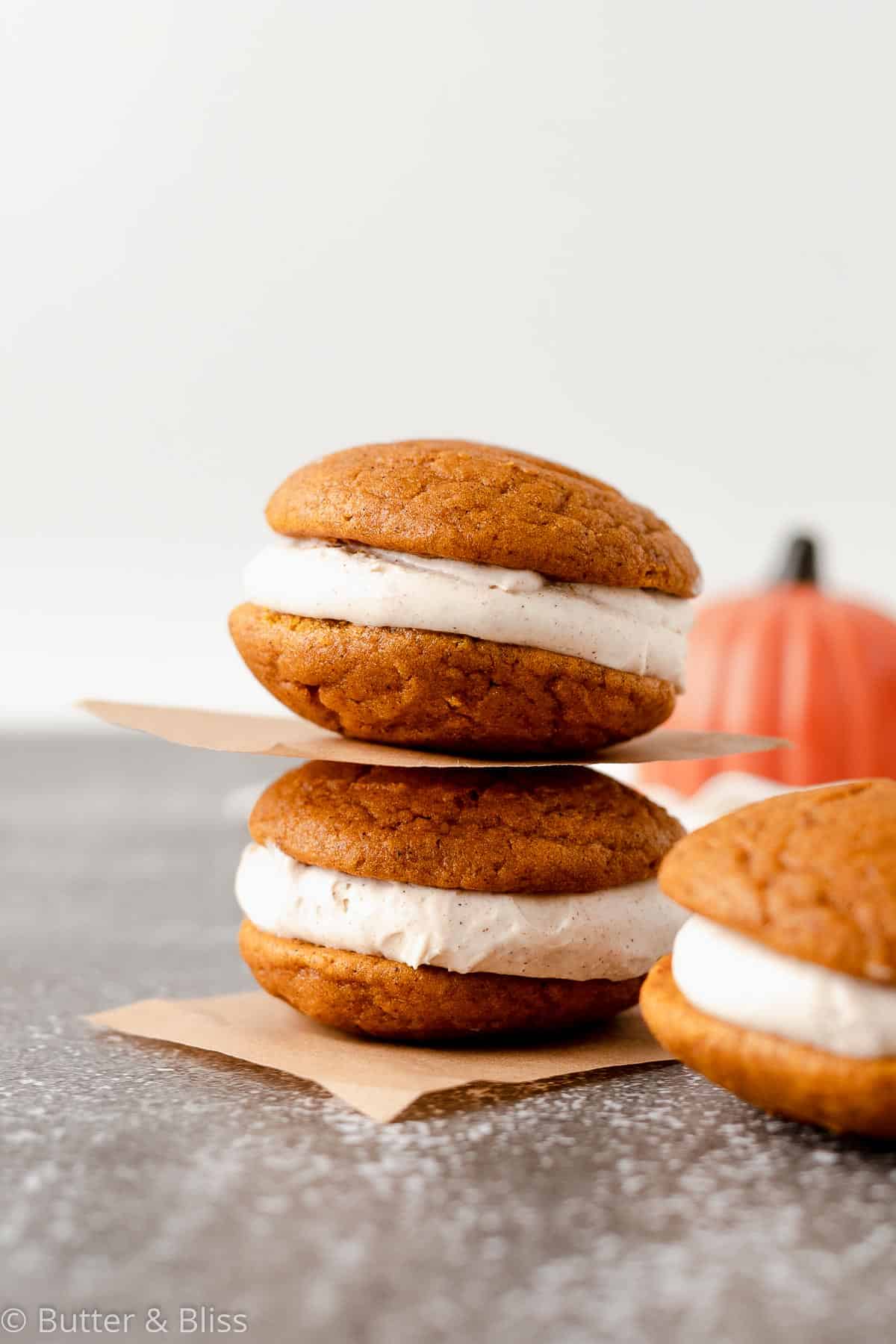 Pumpkin spice whoopie pies in a short stack