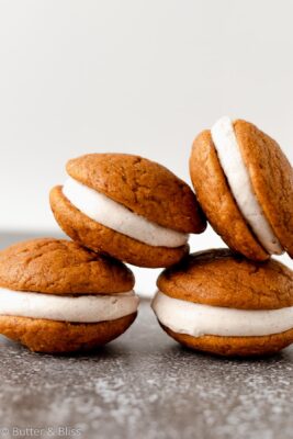 Small batch of pumpkin whoopie pies stacked in a pyramid