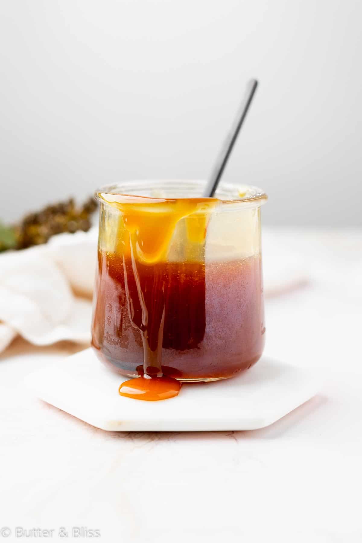 Maple syrup caramel sauce in a small jar