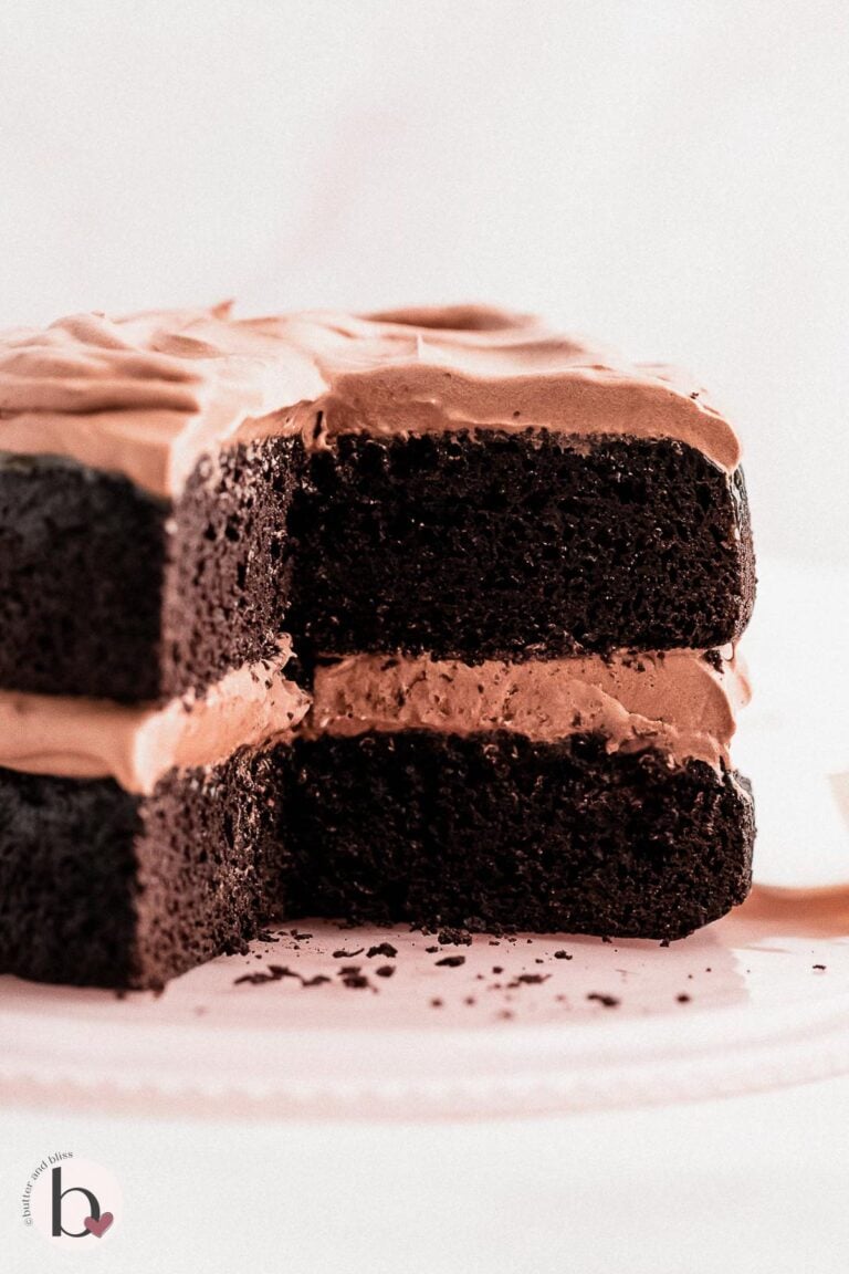 Small batch chocolate layer cake with slices cut.